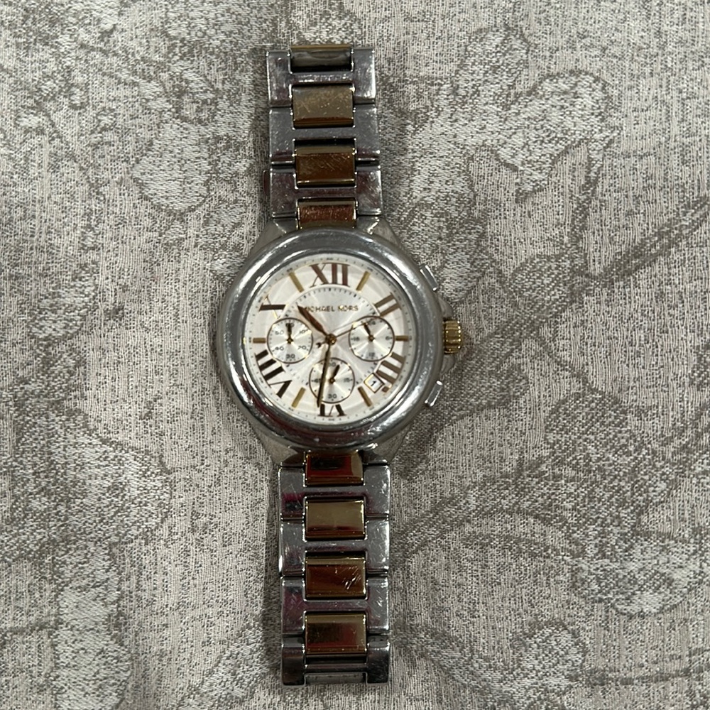 Michael kors cold and silver large watch.